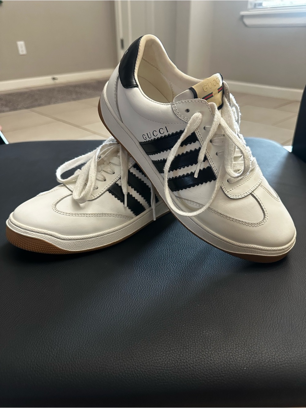 Gucci White Leather Sneakers with Black Stripe Accents